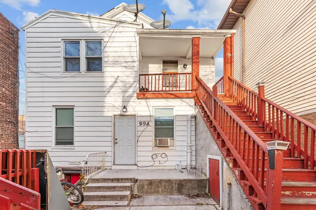 a view of a building with car parked