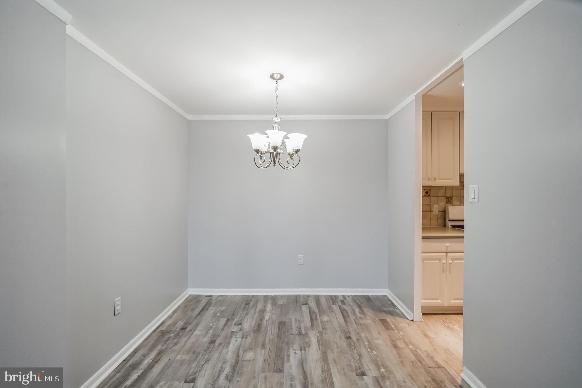 6100 Henry Avenue, Unit 4I Philadelphia, PA 19128 - Photo 12 of 30 a view of wooden floor in an empty room