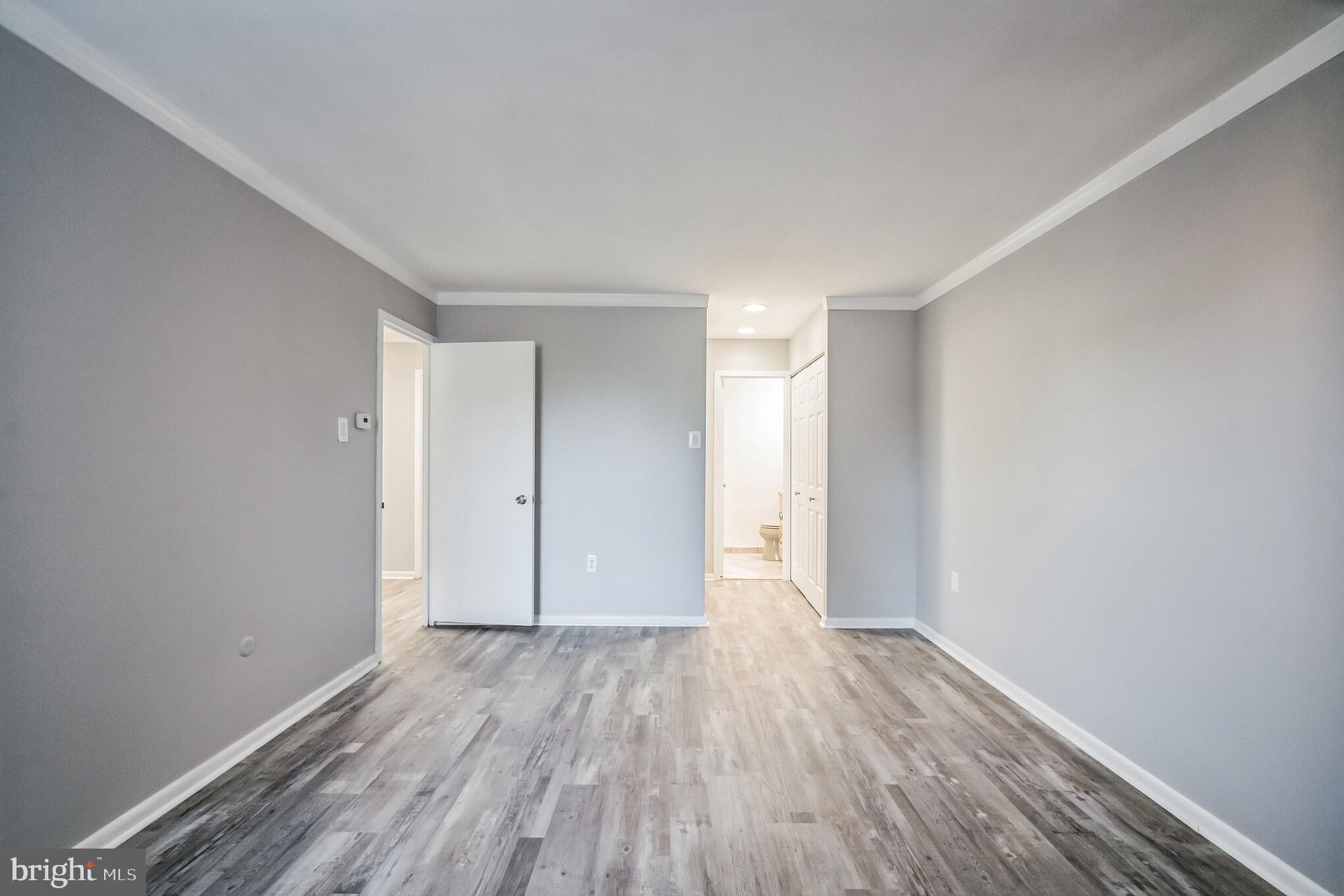 6100 Henry Avenue, Unit 4I Philadelphia, PA 19128 - Photo 17 of 30 a view of a room with wooden floor