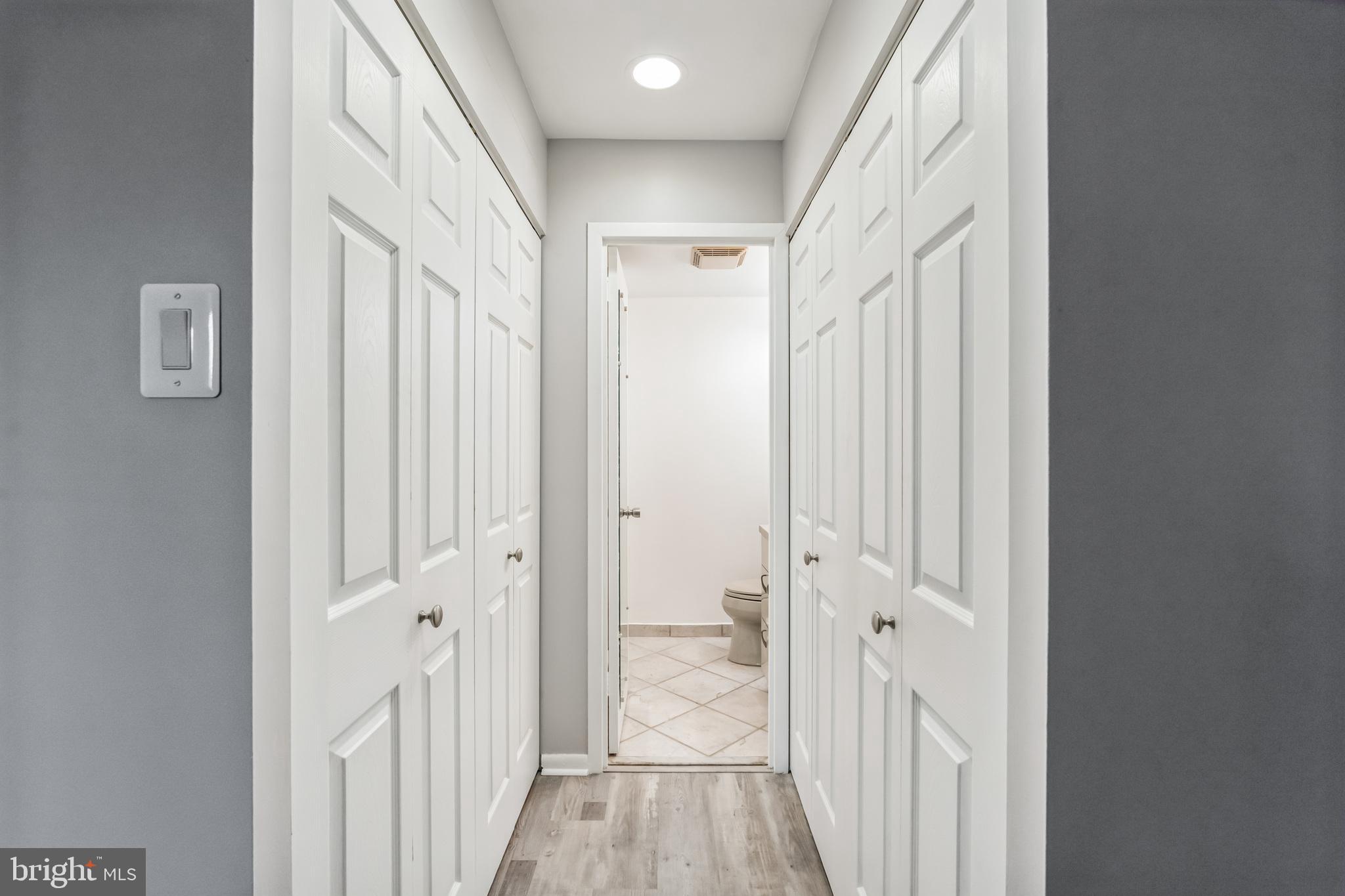 6100 Henry Avenue, Unit 4I Philadelphia, PA 19128 - Photo 18 of 30 a view of a hallway with a wooden door