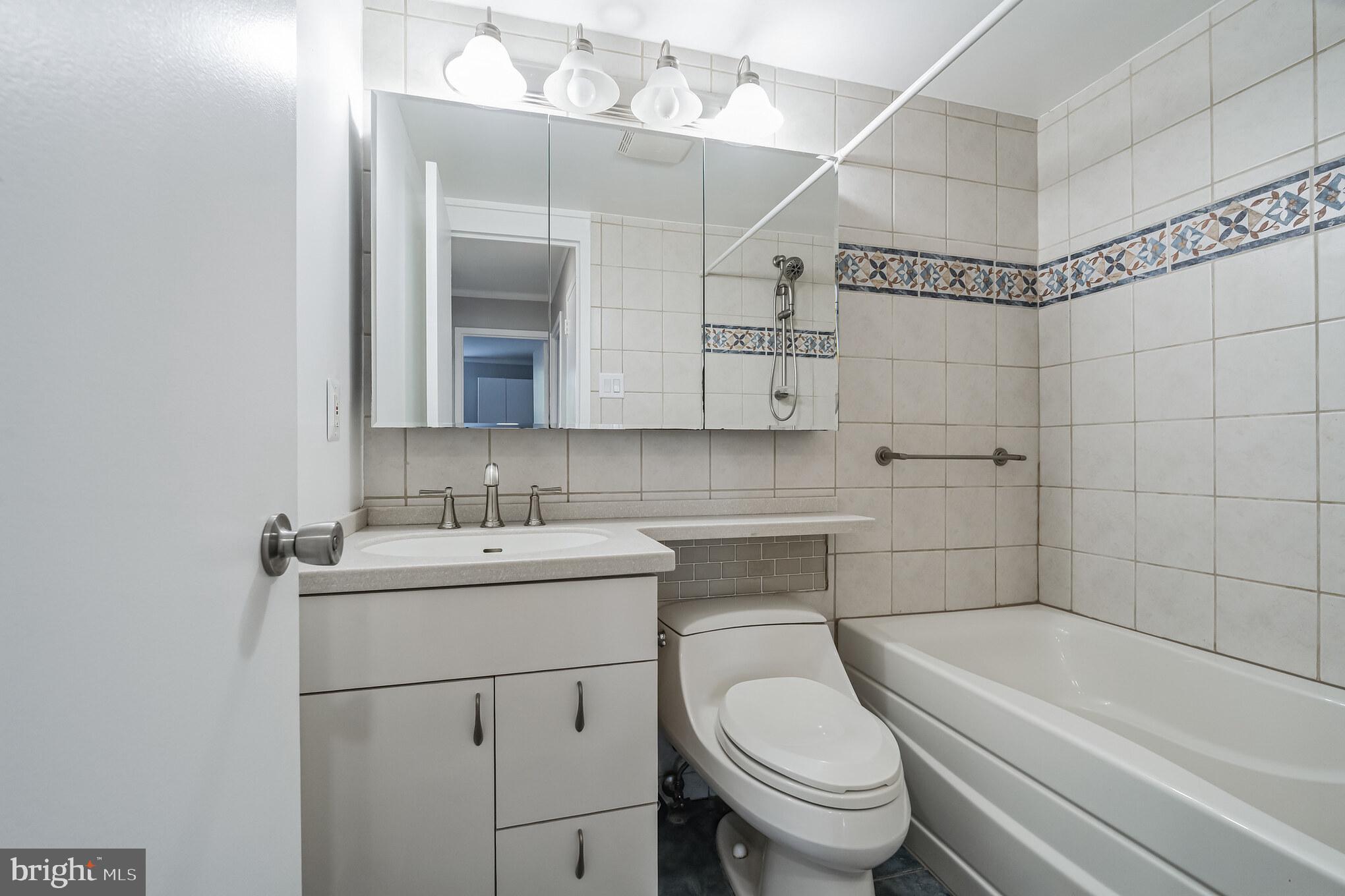 6100 Henry Avenue, Unit 4I Philadelphia, PA 19128 - Photo 22 of 30 a bathroom with a sink a toilet and shower