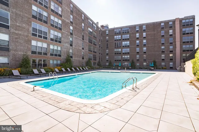 a view of a swimming pool with a lounge chairs