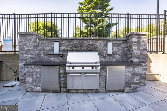 a kitchen with a stove and a white refrigerator