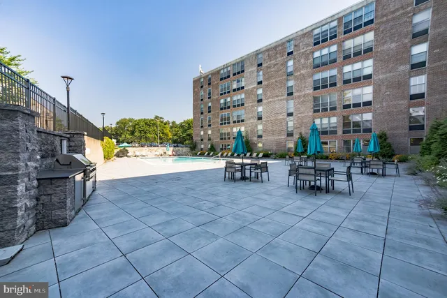 a patio with table and chairs