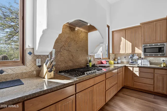 a living room with fireplace furniture and a flat screen tv