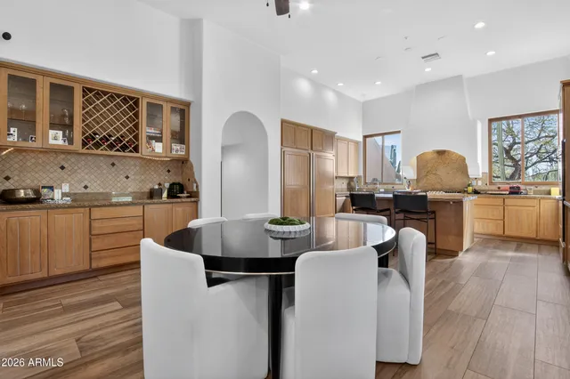 a spacious bathroom with a sink a mirror a vanity and shower