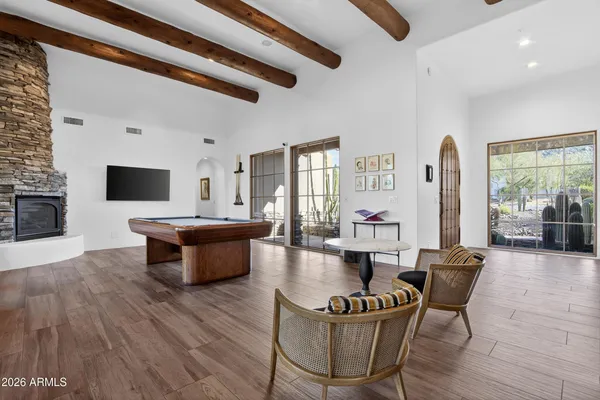a en suite bathroom with a granite countertop sink and a mirror