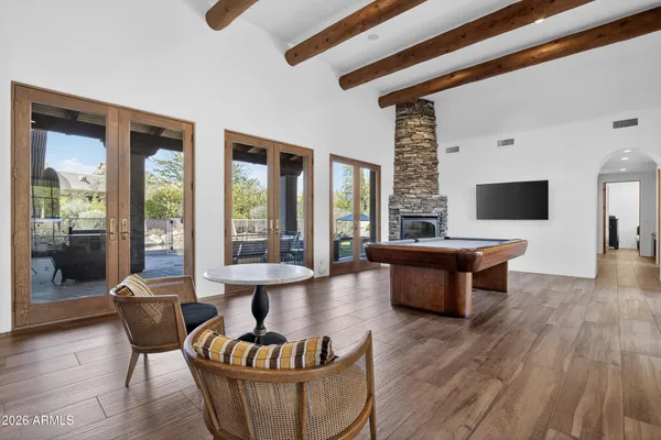 a bathroom with a granite countertop double vanity sink and mirror