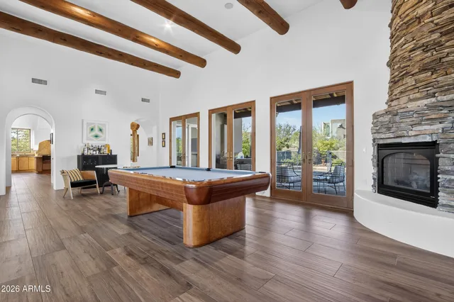 a en suite bathroom with a granite countertop sink and a mirror