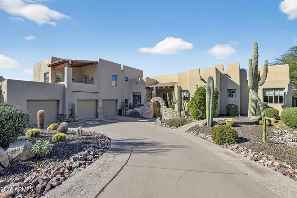a view of a house with patio and plants