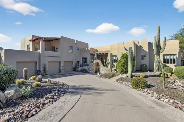 a view of a house with patio and plants