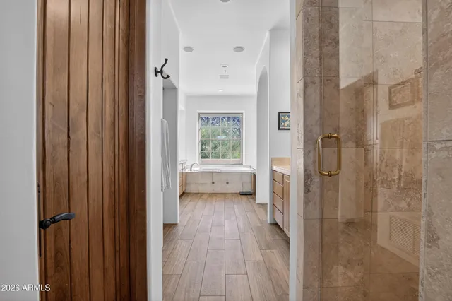 a bathroom with a toilet a sink and a mirror