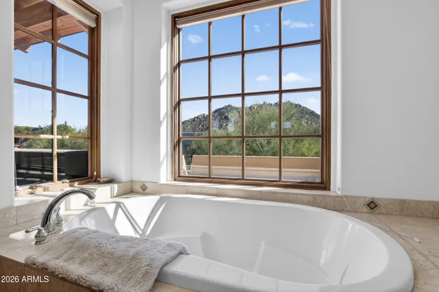 a kitchen with a sink and a view of living room