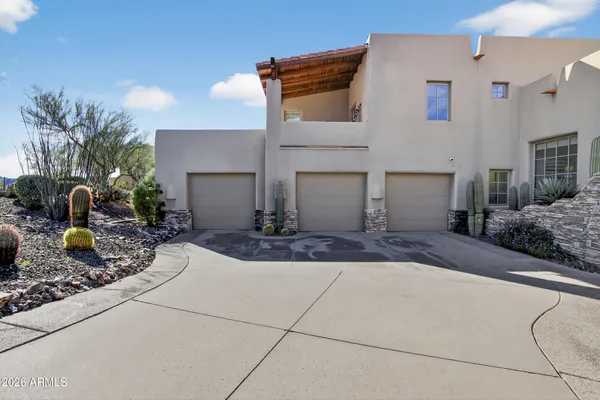 a kitchen with a sink cabinets and wooden floor