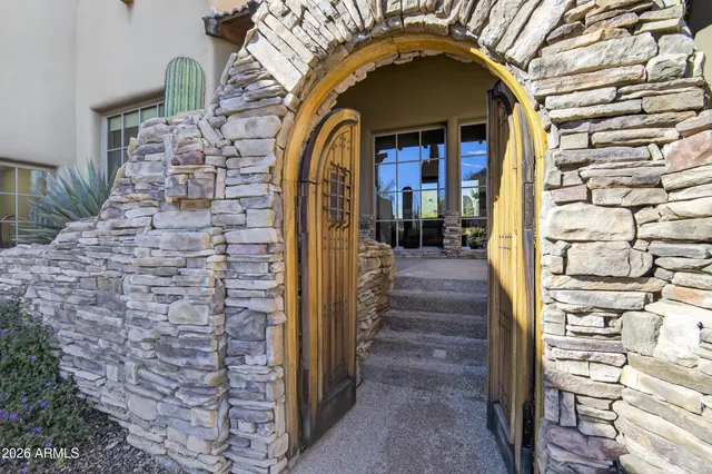 a kitchen with a sink appliances and cabinets