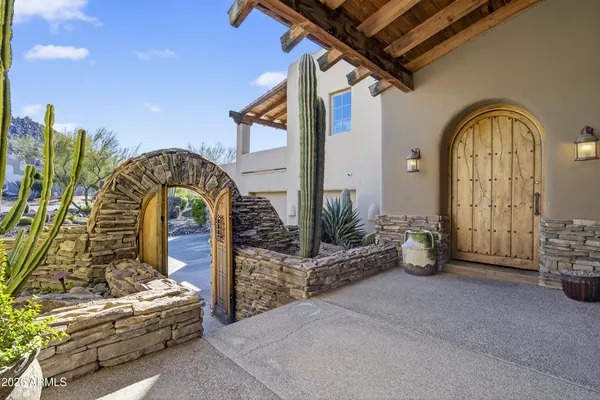a kitchen with granite countertop a sink and stainless steel appliances