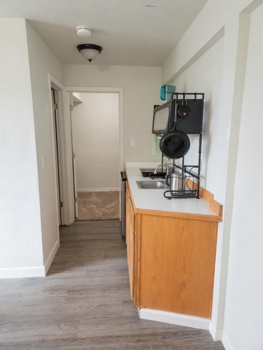 4850 8 Mile Road Camino, CA 95709 - Photo 15 of 30 a room with wooden floor and furniture