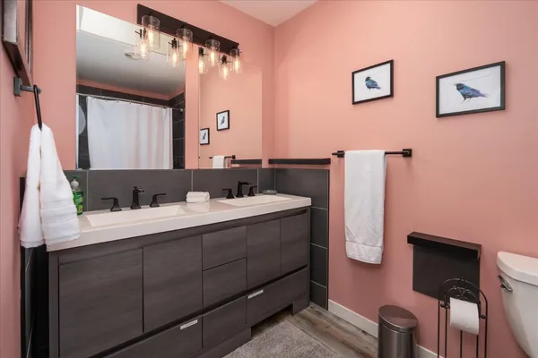 a bathroom with a sink and a mirror