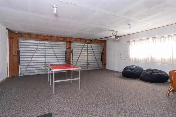 a room that has a bed and a chair