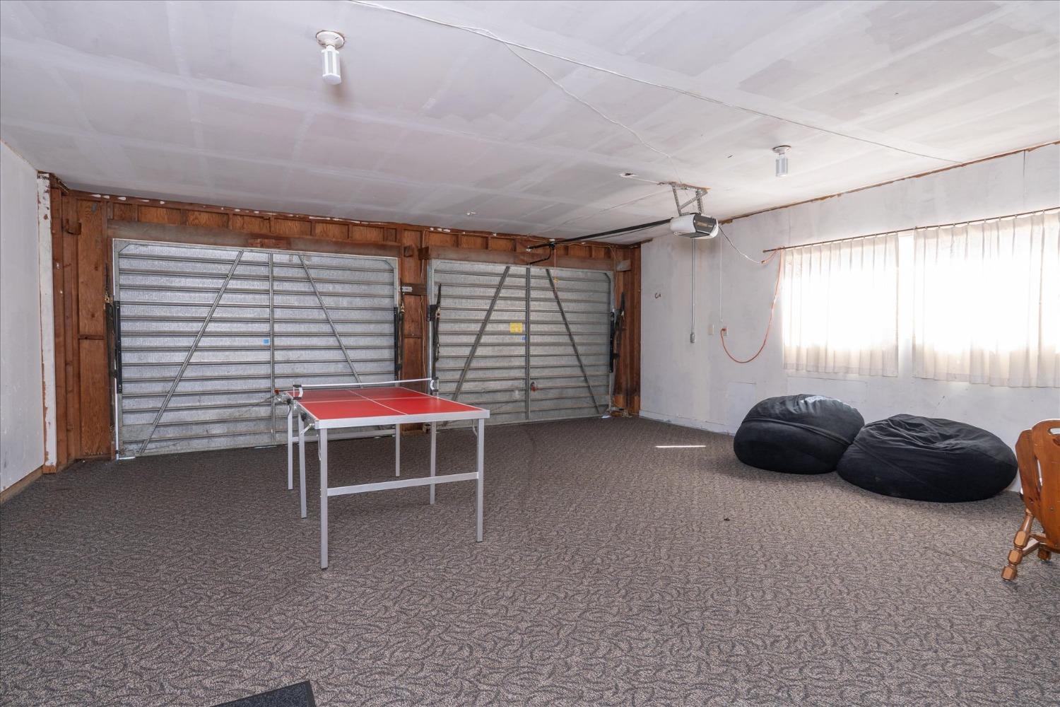42324 Buckeye Road Oakhurst, CA 93644 - Photo 30 of 45 a room that has a bed and a chair