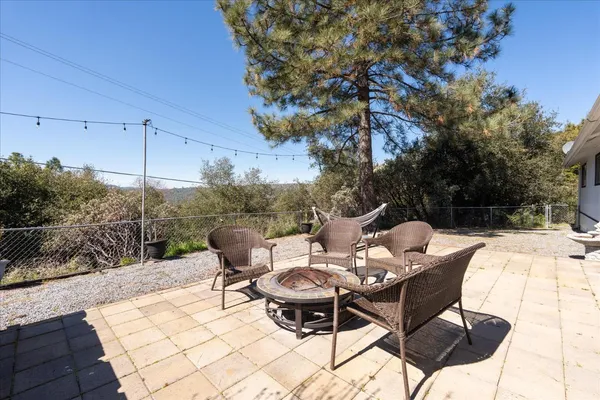 a view of a patio in the backyard