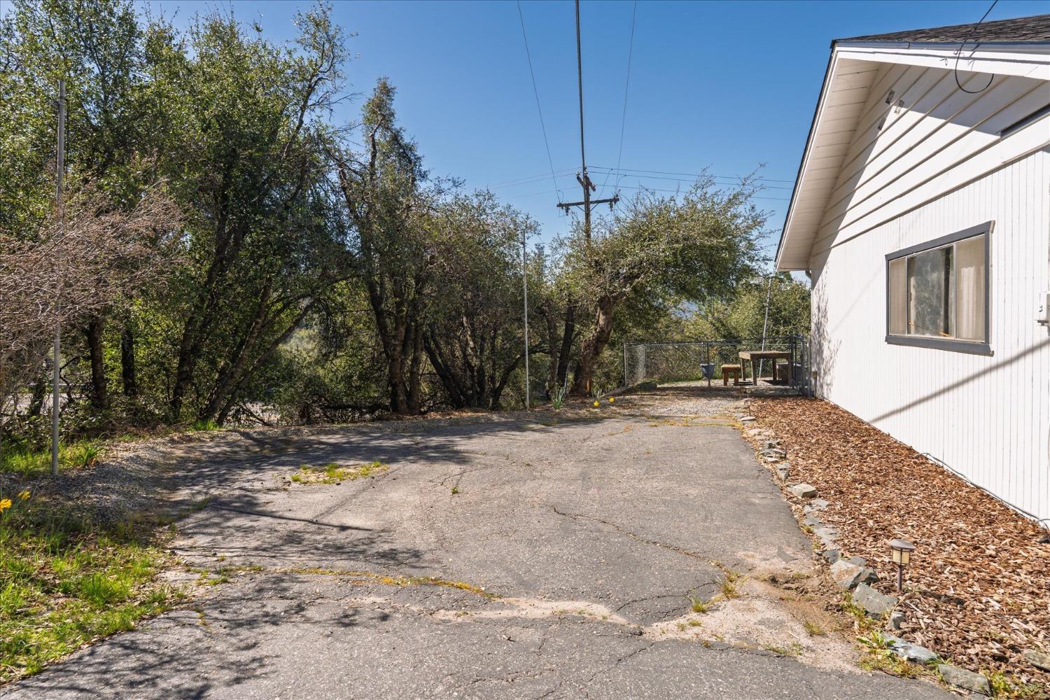 42324 Buckeye Road Oakhurst, CA 93644 - Photo 41 of 45 a view of a house with a yard