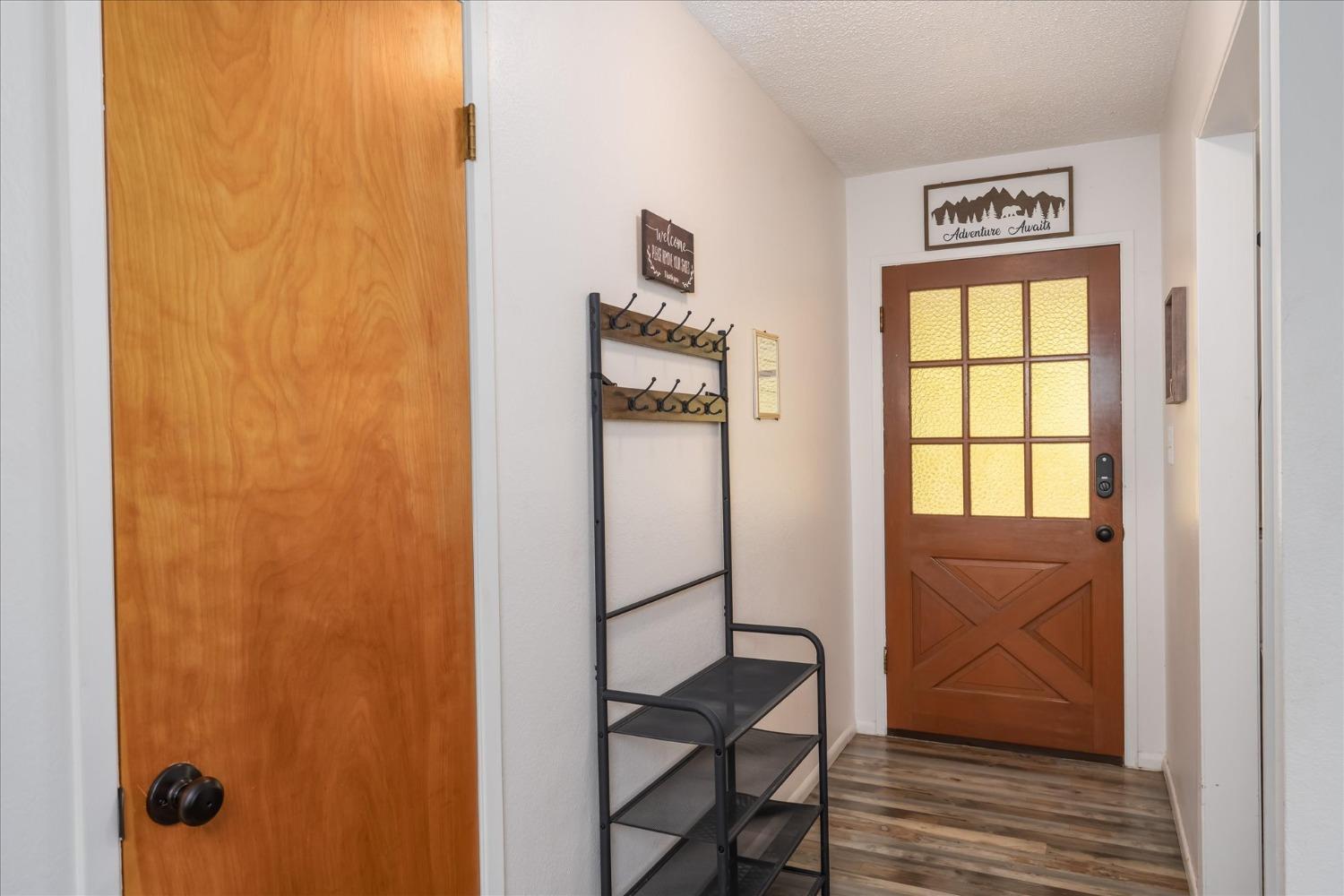 42324 Buckeye Road Oakhurst, CA 93644 - Photo 7 of 45 a view of front door with wooden floor