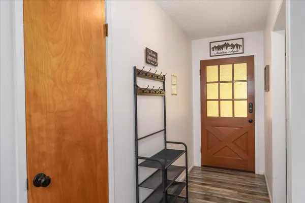 a view of front door with wooden floor