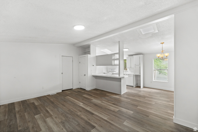 2875 North 400 West, Unit 7 Layton, UT 84041 - Photo 7 of 29 Bright interior space featuring wood-finish flooring and white walls