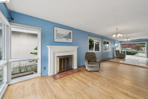 a bedroom with furniture and a fireplace