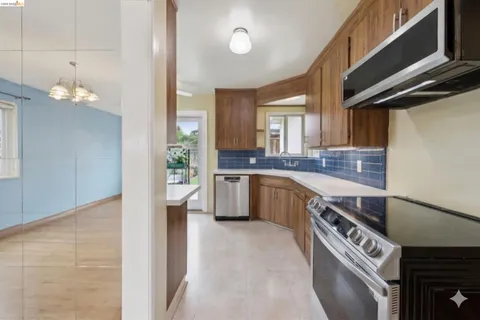 a kitchen with a sink cabinets and window