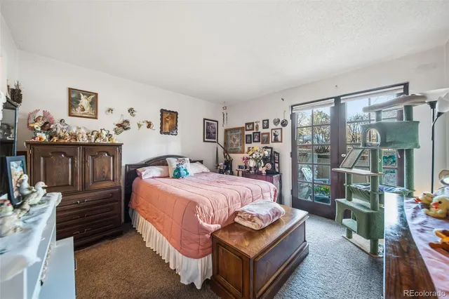 a bedroom with a bed and a night stand