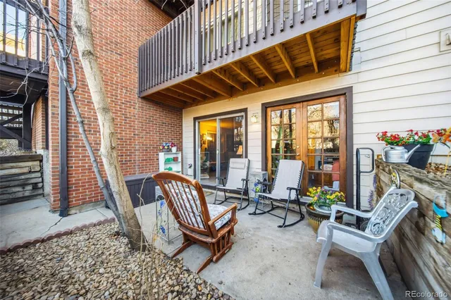 a view of two chairs in the balcony