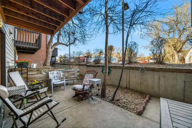 a view of a chairs and table in a patio