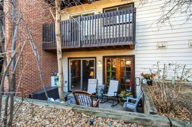 a view of a brick building with a bench in front of building