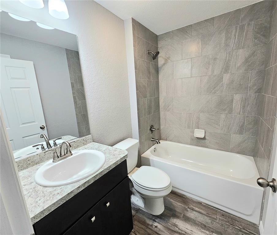 6312 Southwest 134th Loop Ocala, FL 34473 - Photo 12 of 13 a bathroom with a sink toilet and shower