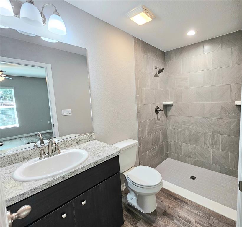 6312 Southwest 134th Loop Ocala, FL 34473 - Photo 10 of 13 a bathroom with a sink a toilet and shower