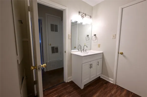 a bathroom with a double vanity sink and mirror