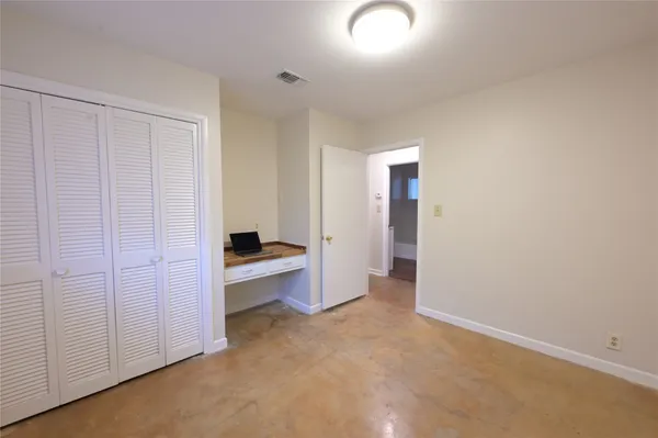 a backyard of a house with a yard and outdoor seating