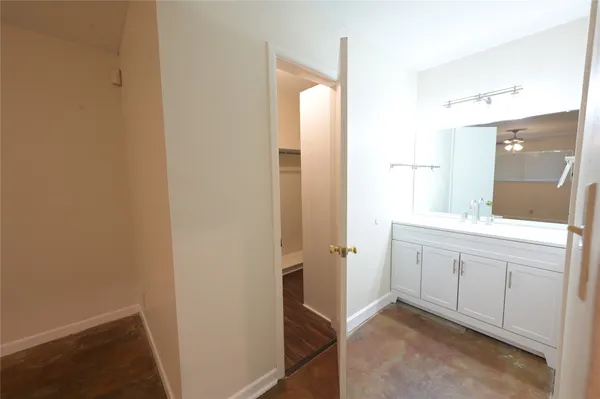 a bathroom with a double vanity sink and mirror