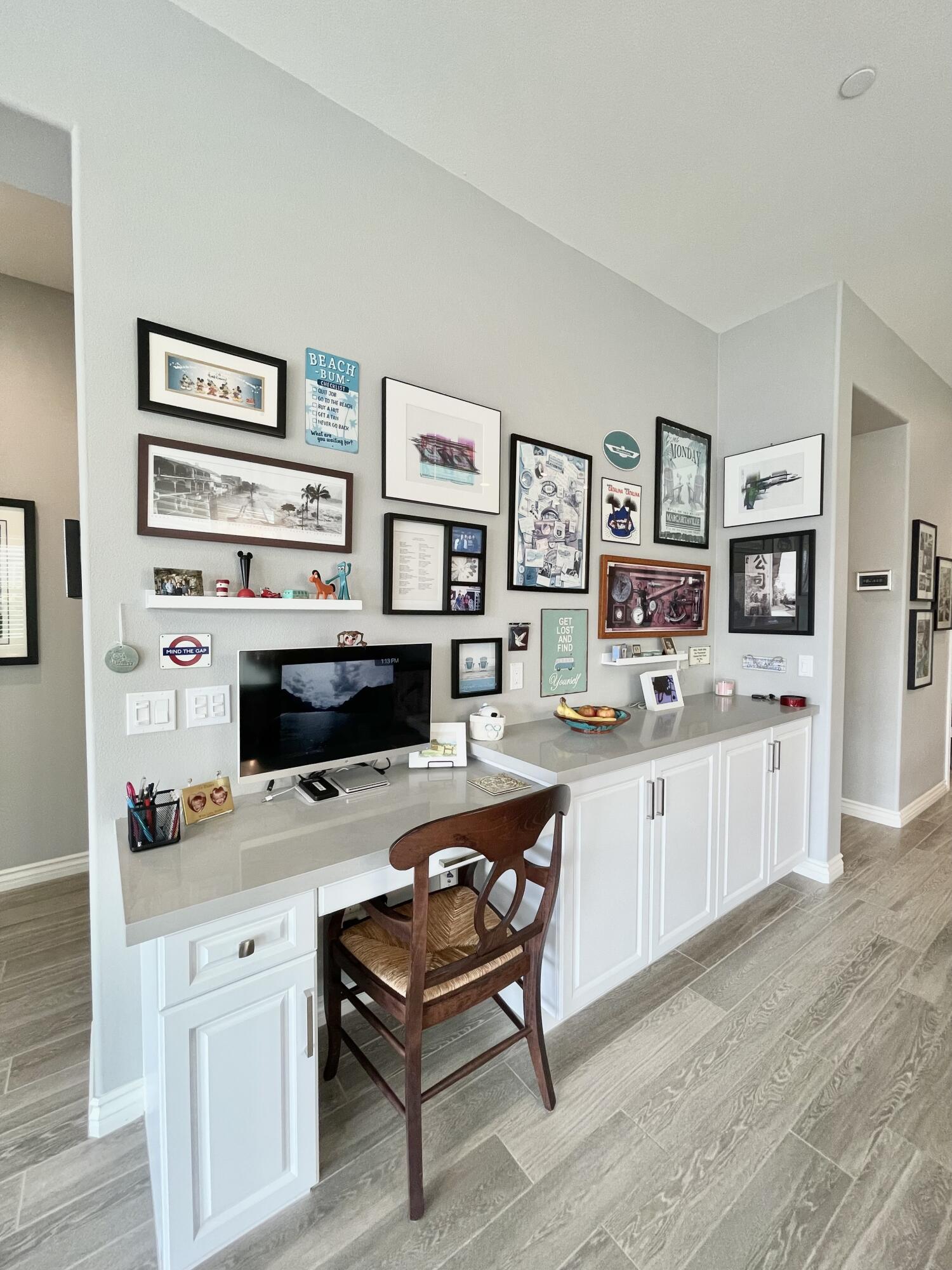 43573 Adria Drive Indio, CA 92203 - Photo 20 of 63 a kitchen with stainless steel appliances a stove refrigerator and white cabinets