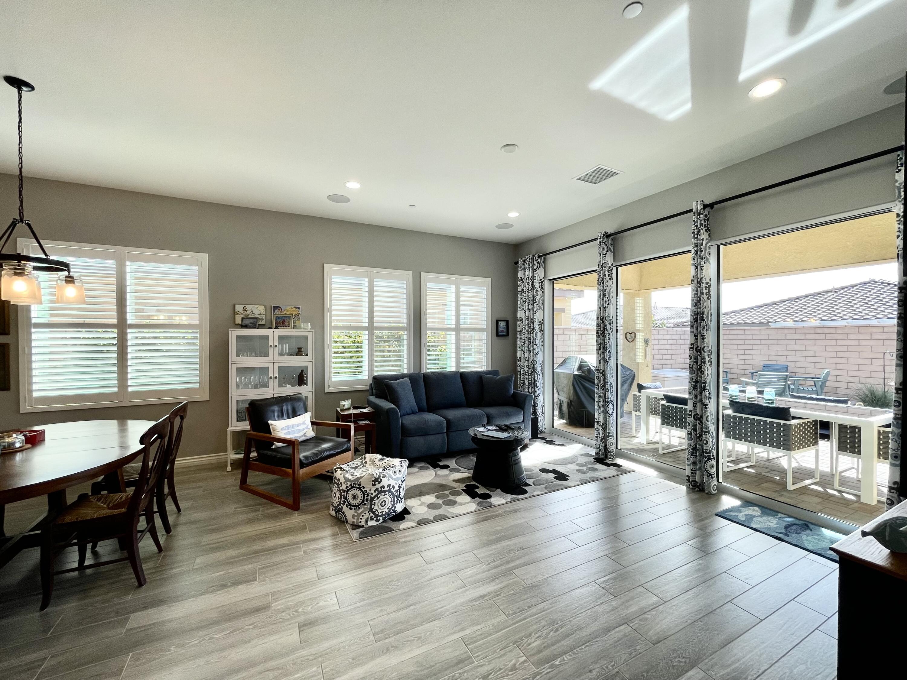 43573 Adria Drive Indio, CA 92203 - Photo 21 of 63 a living room with furniture and large windows