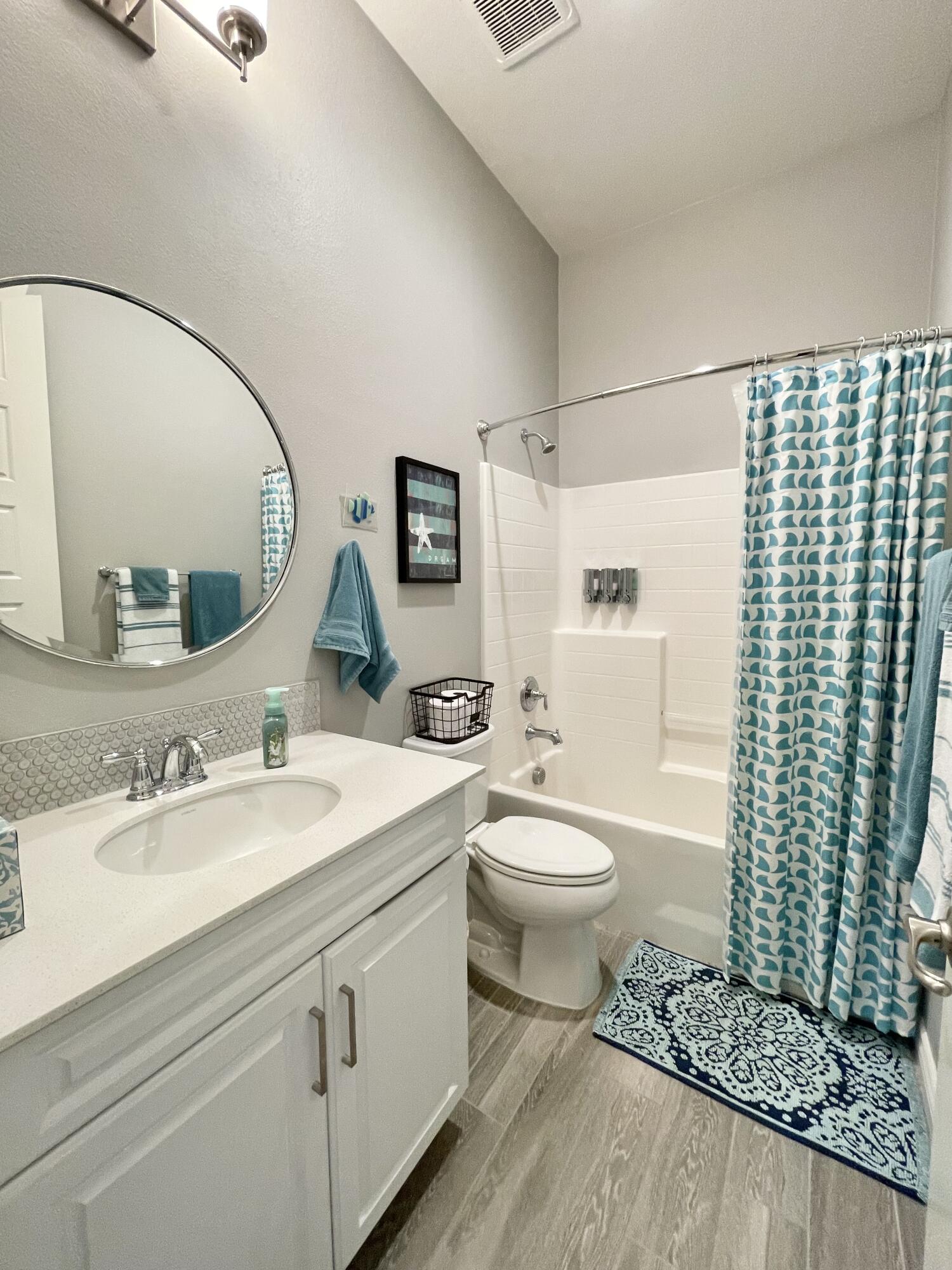 43573 Adria Drive Indio, CA 92203 - Photo 23 of 63 a bathroom with a toilet a sink and a mirror