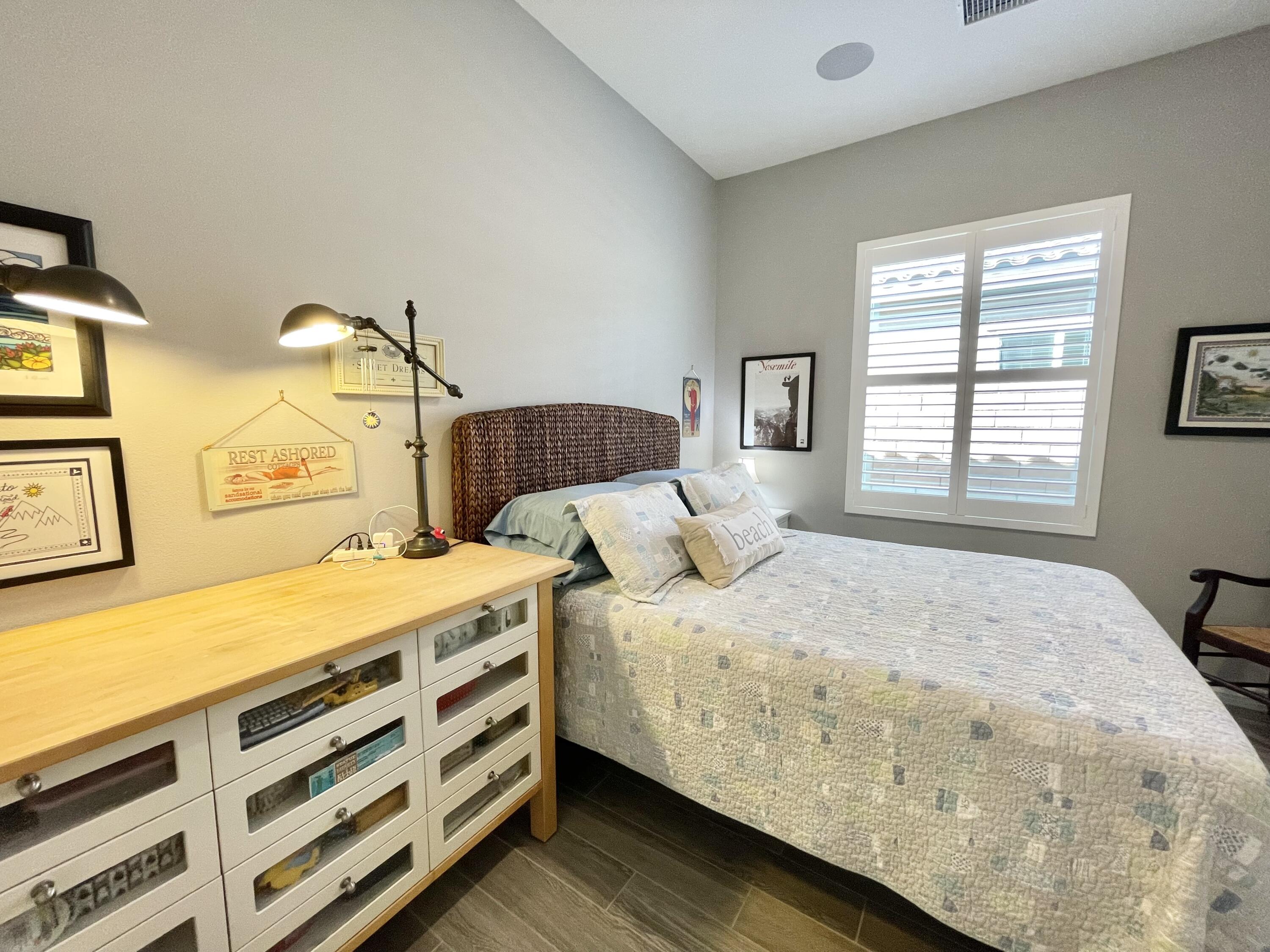 43573 Adria Drive Indio, CA 92203 - Photo 24 of 63 a bedroom with a bed and a window