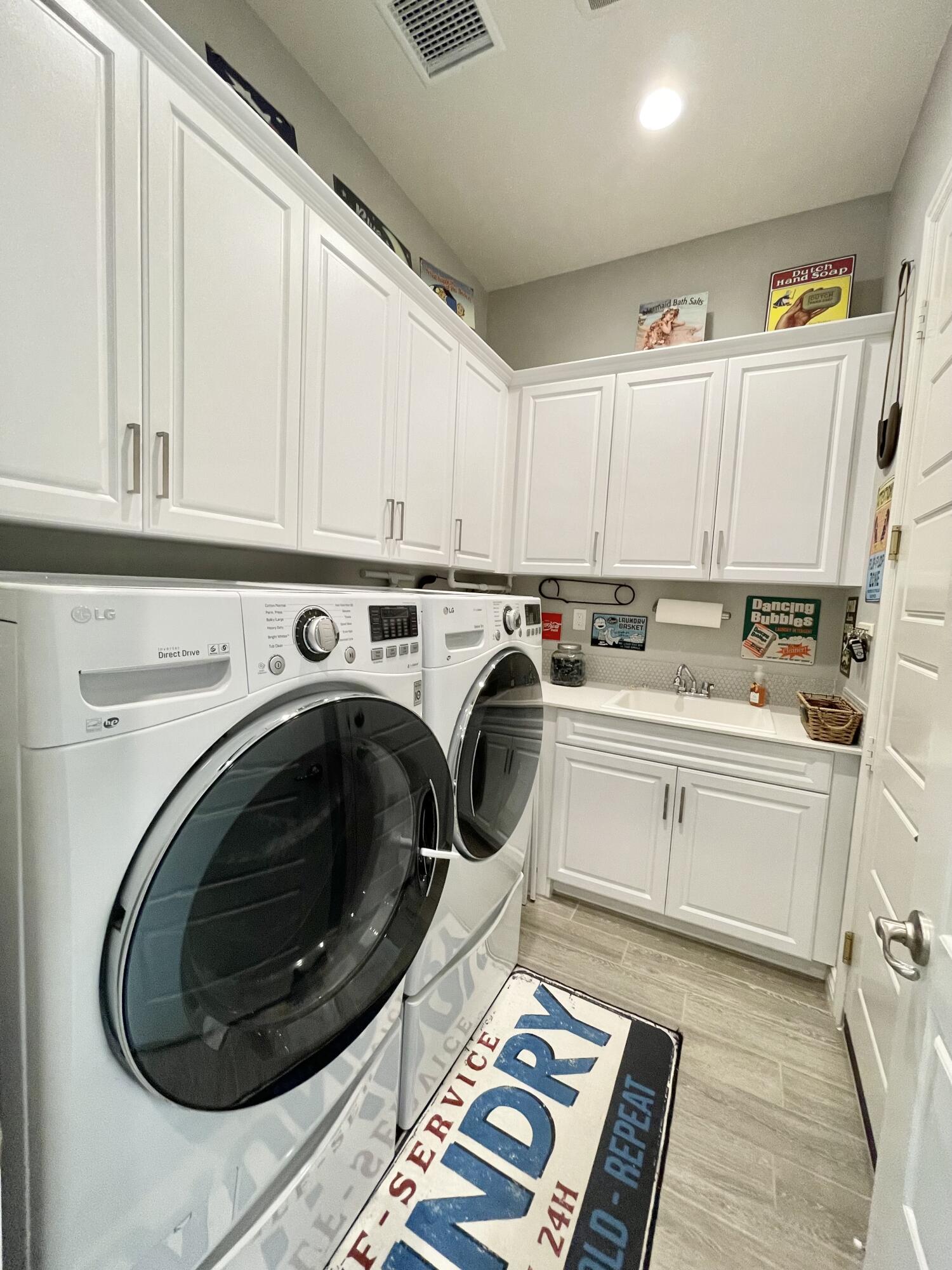 43573 Adria Drive Indio, CA 92203 - Photo 28 of 63 a utility room with sink dryer and washer
