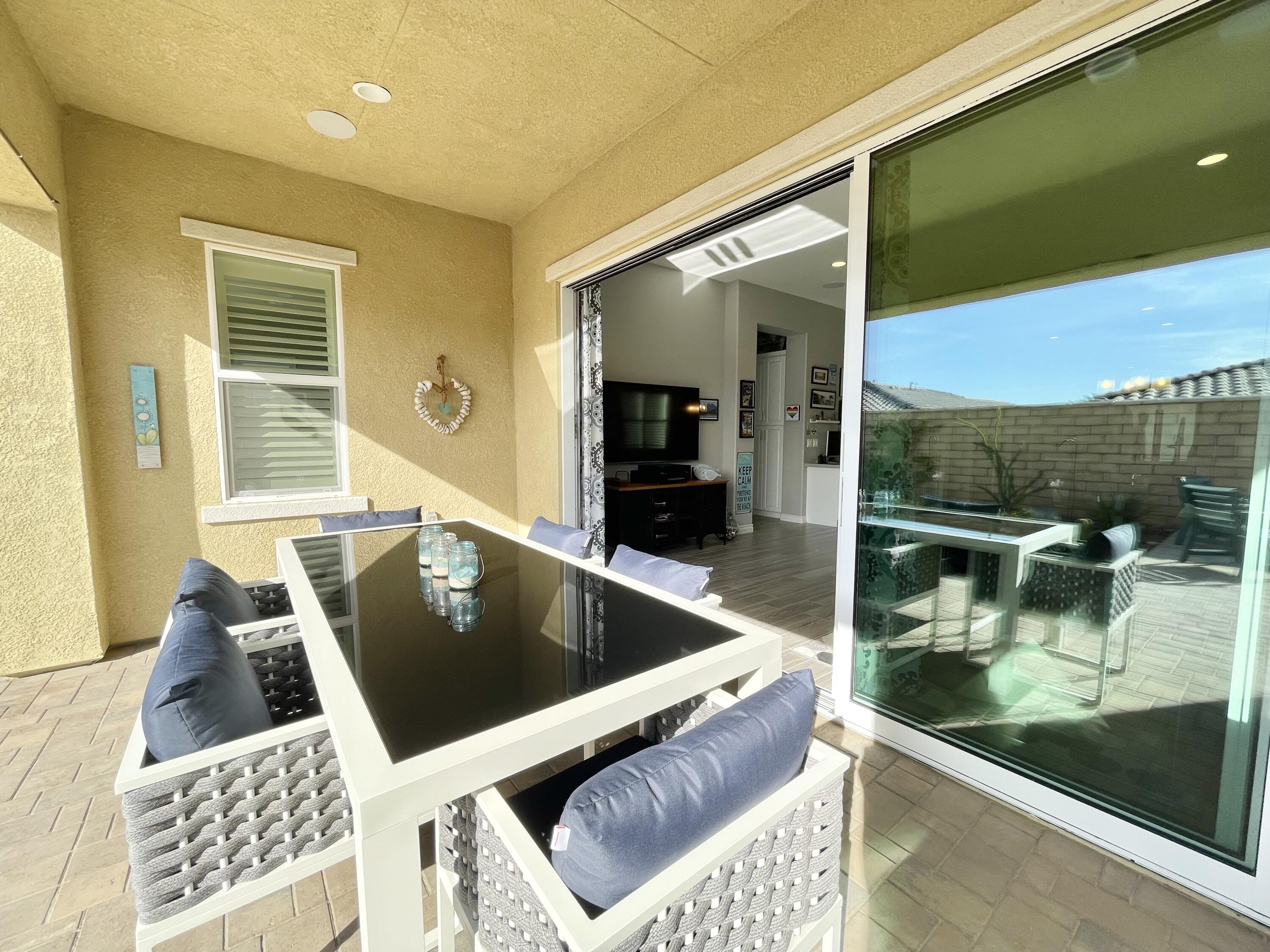 43573 Adria Drive Indio, CA 92203 - Photo 33 of 63 a living room with a couch and a coffee table