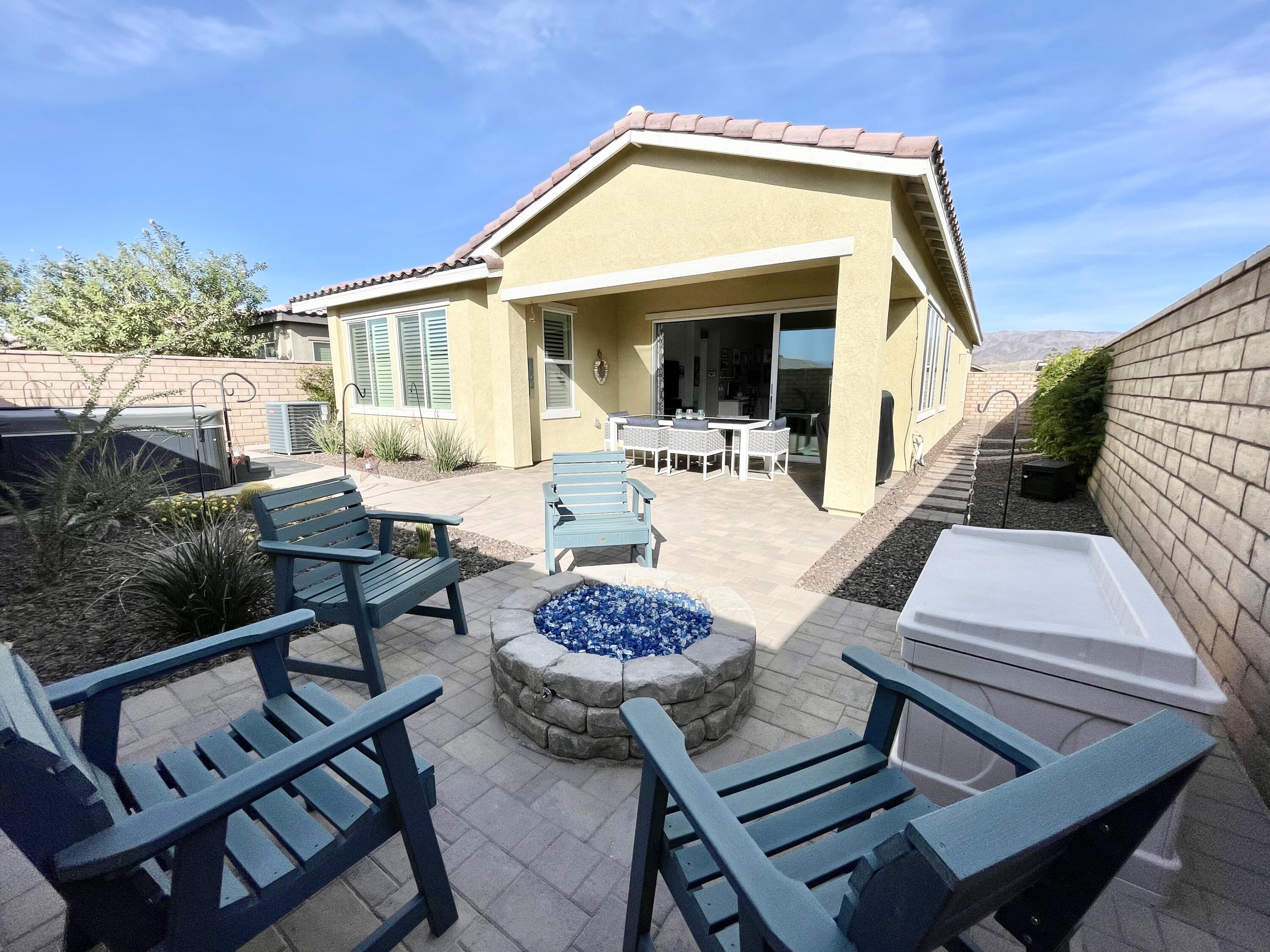 43573 Adria Drive Indio, CA 92203 - Photo 35 of 63 a view of a dinning table and chair in the patio
