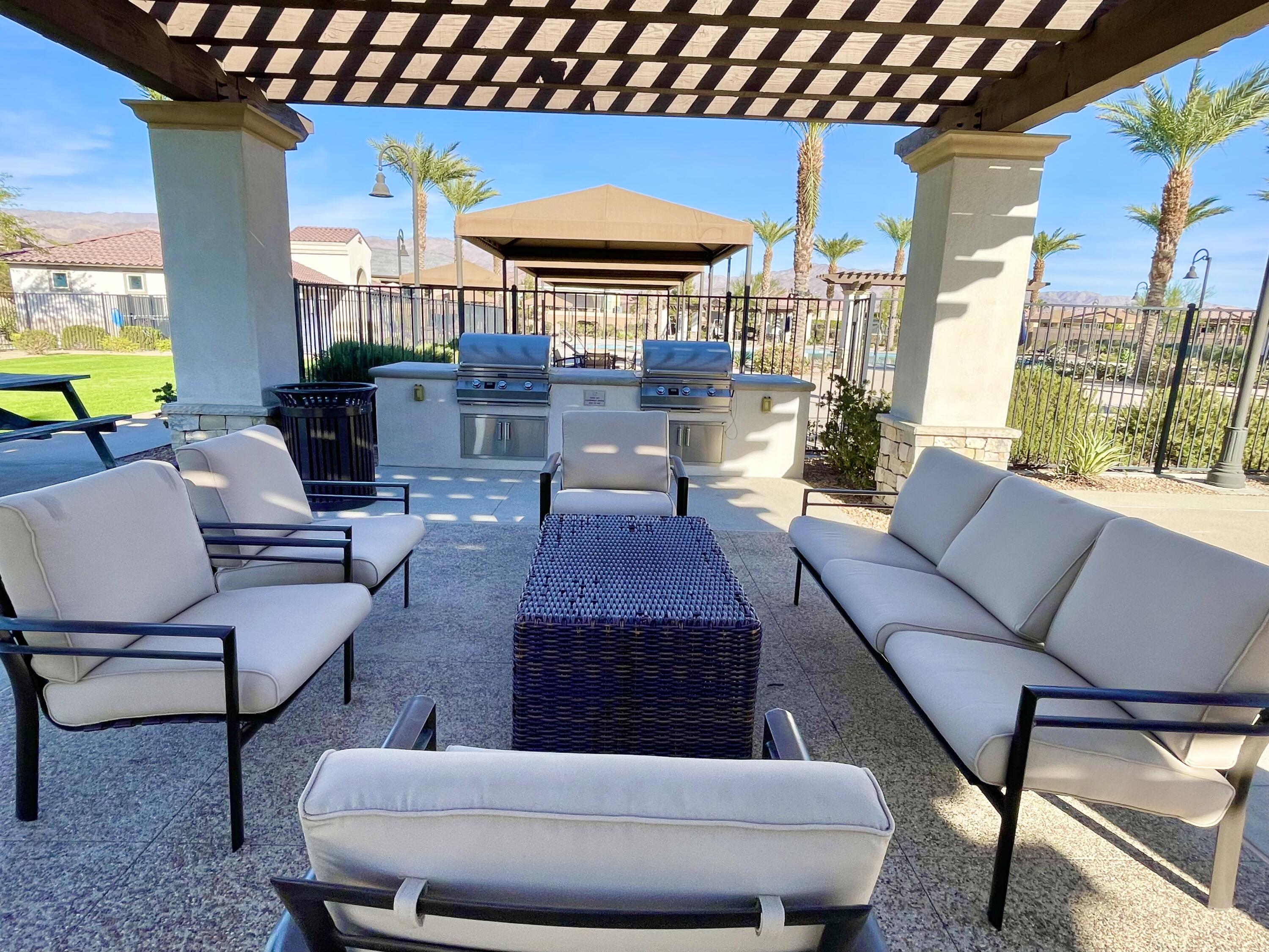 43573 Adria Drive Indio, CA 92203 - Photo 51 of 63 a outdoor living space with furniture and a fireplace