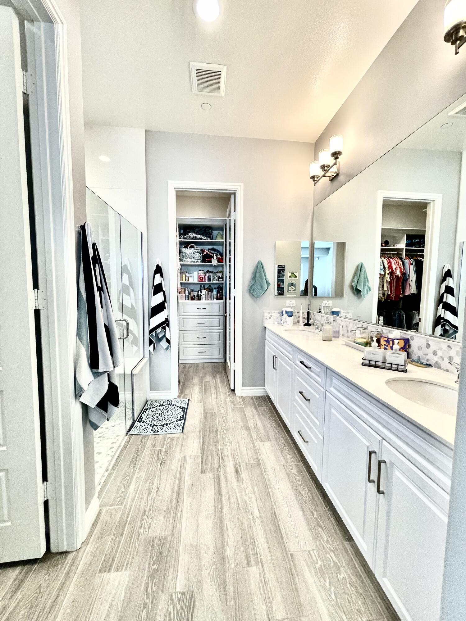 43573 Adria Drive Indio, CA 92203 - Photo 7 of 63 a bathroom with a sink a mirror and a shower