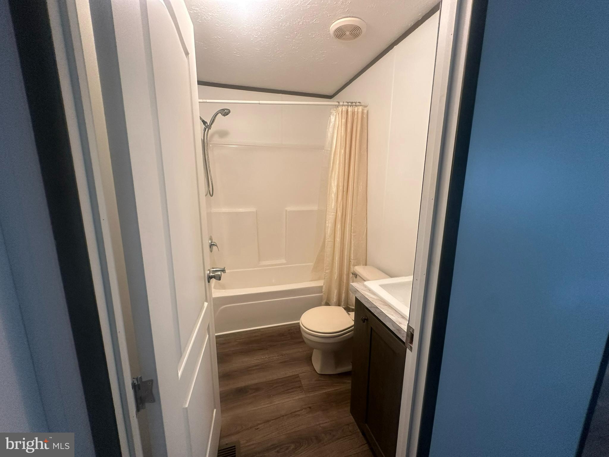 21182 Marsh Creek Road Preston, MD 21655 - Photo 12 of 17 a bathroom with a shower and a toilet